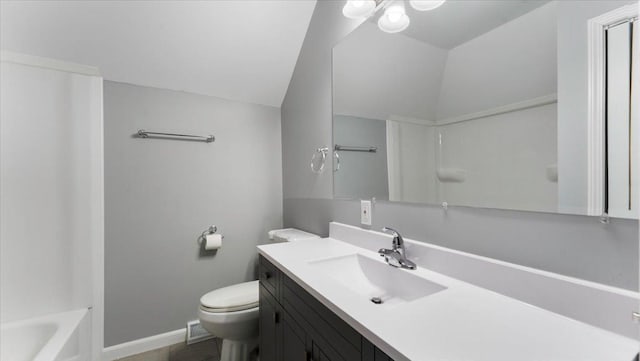 full bath featuring toilet, vaulted ceiling, baseboards, a bathing tub, and vanity