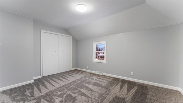 bonus room with baseboards, vaulted ceiling, visible vents, and carpet
