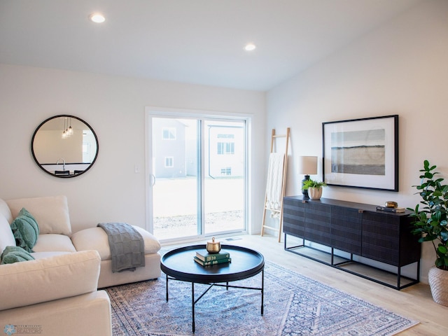 living room with recessed lighting and light wood-style floors