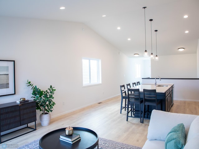 living area featuring recessed lighting and light wood-style floors