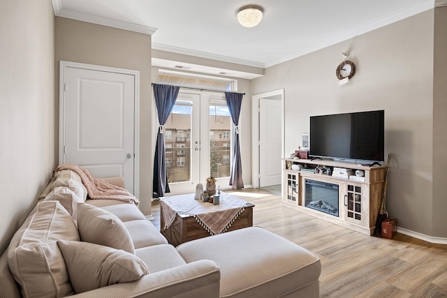 living room with french doors, visible vents, crown molding, baseboards, and light wood-style floors