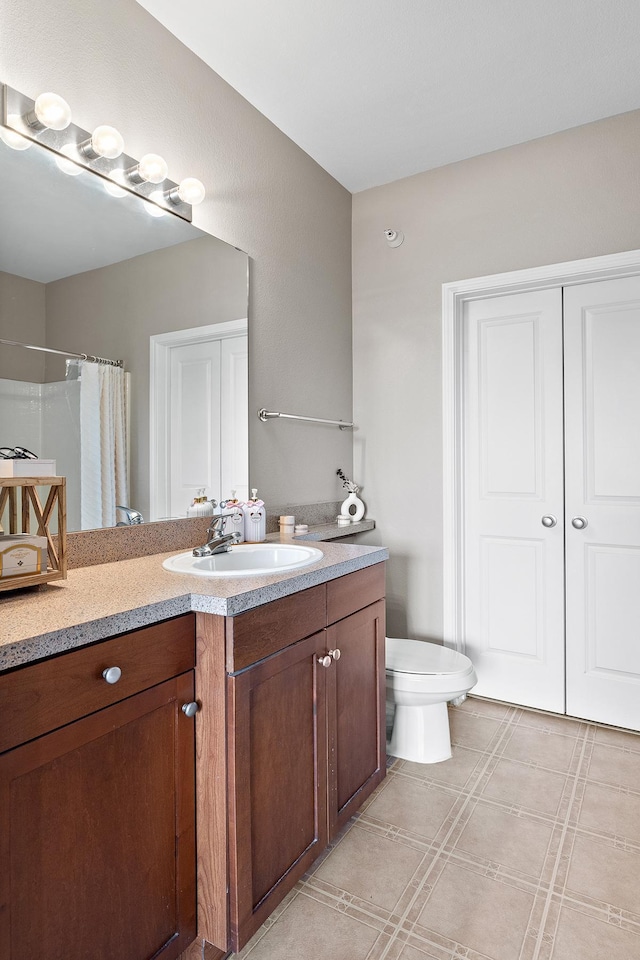 full bathroom with vanity, tile patterned flooring, toilet, and a shower with shower curtain