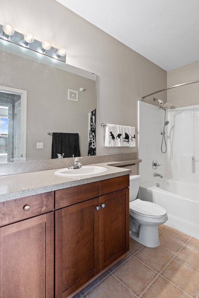 full bath with vanity, toilet, tile patterned floors, shower / washtub combination, and visible vents