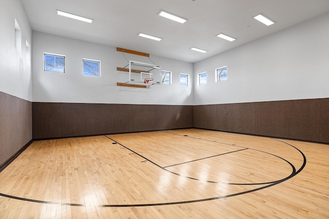 view of sport court featuring a wealth of natural light and basketball court