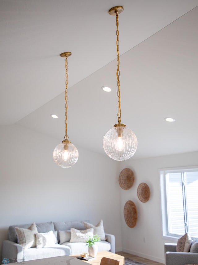 living area with baseboards, recessed lighting, and wood finished floors