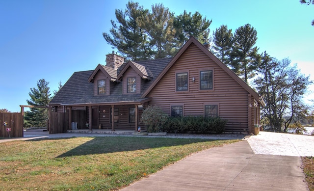 E6516 867th Ave, Colfax, WI 54730 - log-style house featuring covered porch, a chimney, and log siding