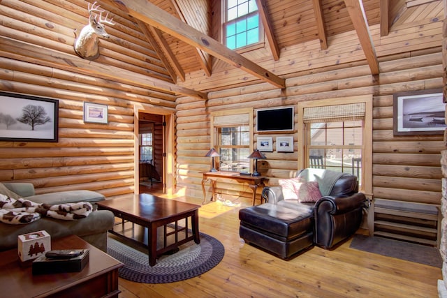 E6516 867th Ave, Colfax, WI 54730 - living room featuring high vaulted ceiling, wood ceiling with exposed beams, wood-type flooring, and rustic walls