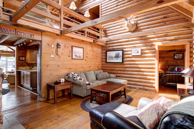 E6516 867th Ave, Colfax, WI 54730 - living area with rustic walls, light wood finished floors, and a high ceiling