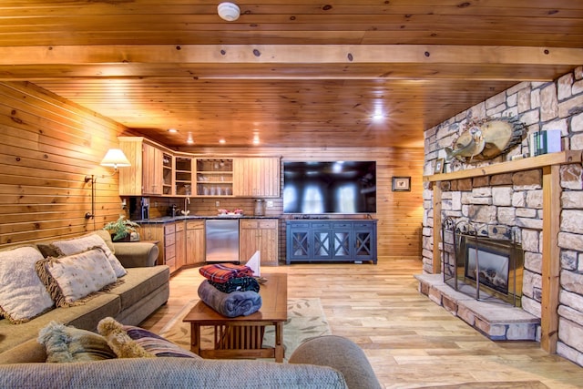 E6516 867th Ave, Colfax, WI 54730 - living room with wooden ceiling, light wood-type flooring, wooden walls, and a stone fireplace