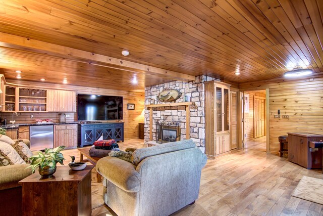 E6516 867th Ave, Colfax, WI 54730 - living room with wooden ceiling, a fireplace, wood walls, and light wood-style floors