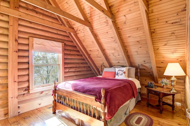 E6516 867th Ave, Colfax, WI 54730 - bedroom featuring wooden ceiling, wood-type flooring, and rustic walls