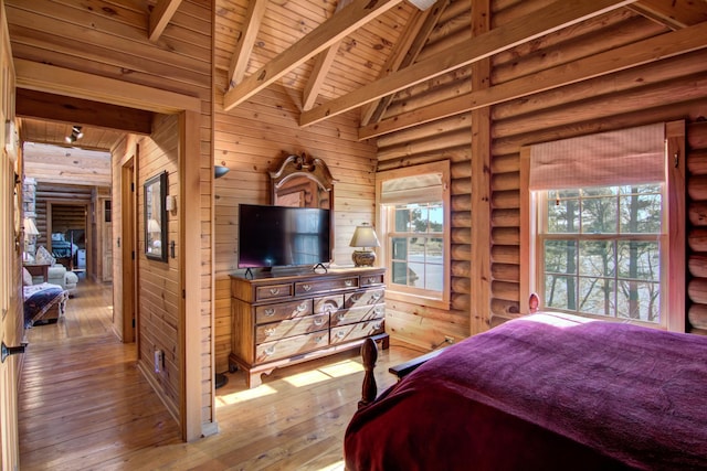 E6516 867th Ave, Colfax, WI 54730 - bedroom with wooden ceiling with exposed beams, hardwood / wood-style floors, wooden walls, and high vaulted ceiling