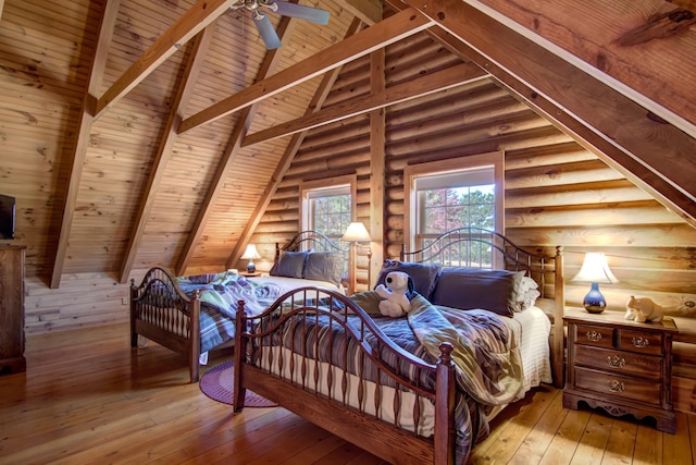E6516 867th Ave, Colfax, WI 54730 - bedroom with wood ceiling, hardwood / wood-style floors, and log walls