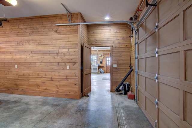 E6516 867th Ave, Colfax, WI 54730 - garage featuring wood walls and recessed lighting