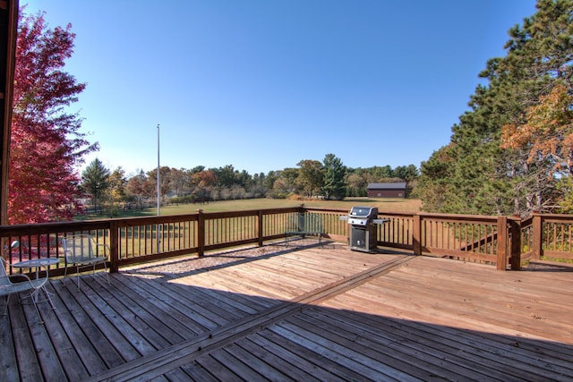 E6516 867th Ave, Colfax, WI 54730 - wooden terrace featuring a grill and view of wooded area