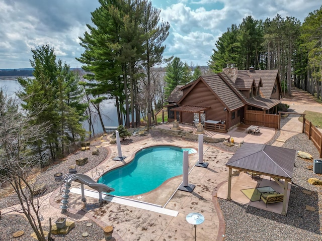 E6516 867th Ave, Colfax, WI 54730 - view of pool featuring a water slide, a patio, cooling unit, and a gazebo