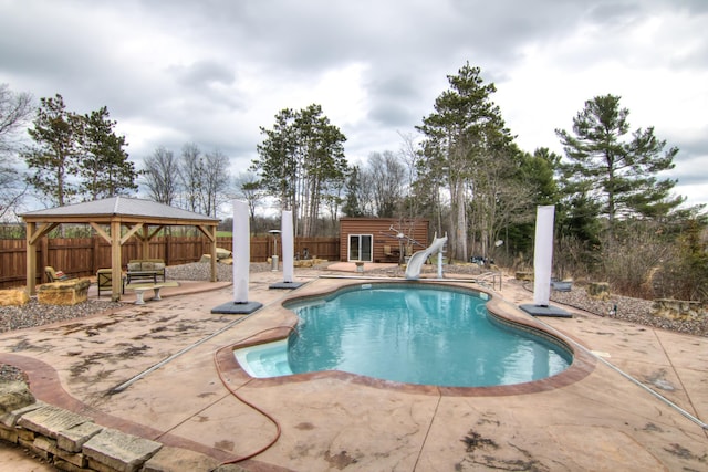 E6516 867th Ave, Colfax, WI 54730 - view of pool featuring a water slide, a patio area, a gazebo, and a fenced backyard