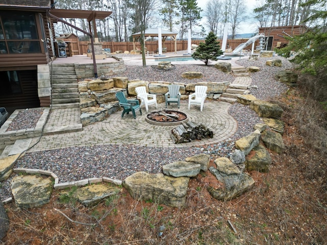E6516 867th Ave, Colfax, WI 54730 - fenced backyard with an outdoor fire pit, a patio, and a gazebo