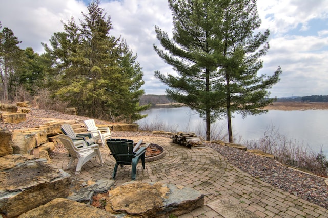 E6516 867th Ave, Colfax, WI 54730 - view of patio featuring an outdoor fire pit and a water view
