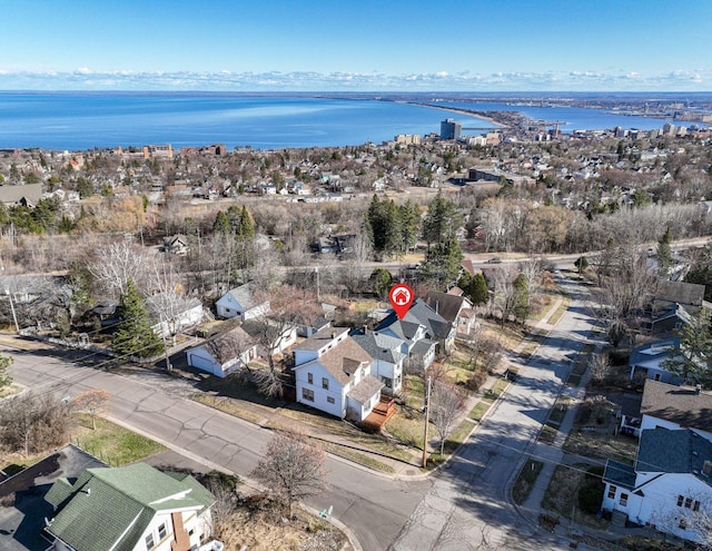 aerial view featuring a residential view and a water view