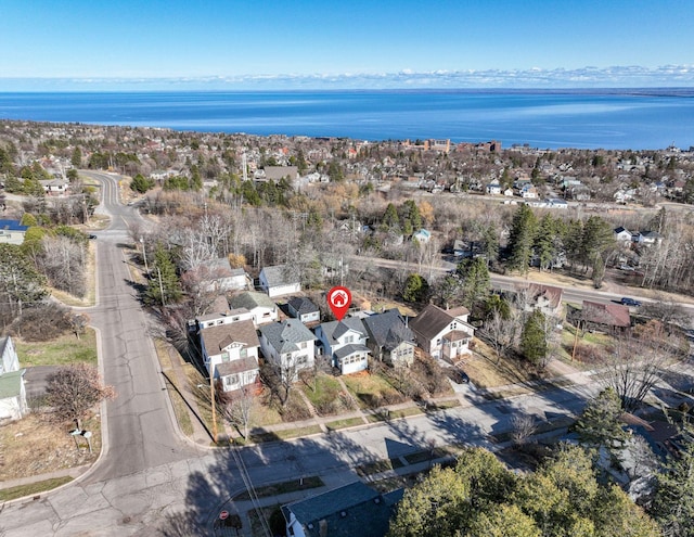 birds eye view of property featuring a residential view and a water view
