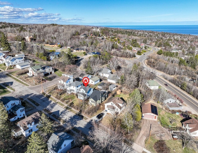 bird's eye view with a residential view and a water view