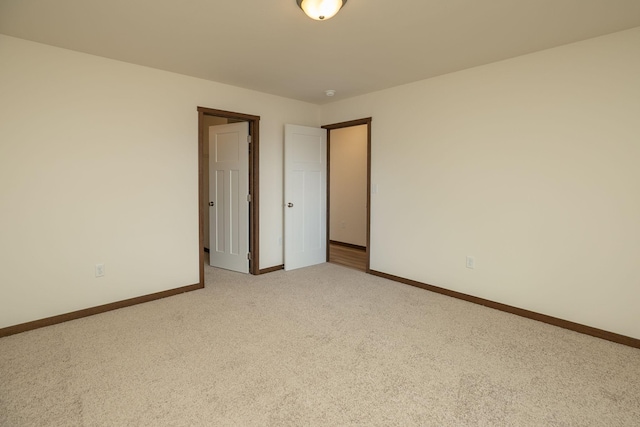 214 4th Pl, Claremont, MN 55924 - empty room featuring light carpet and baseboards