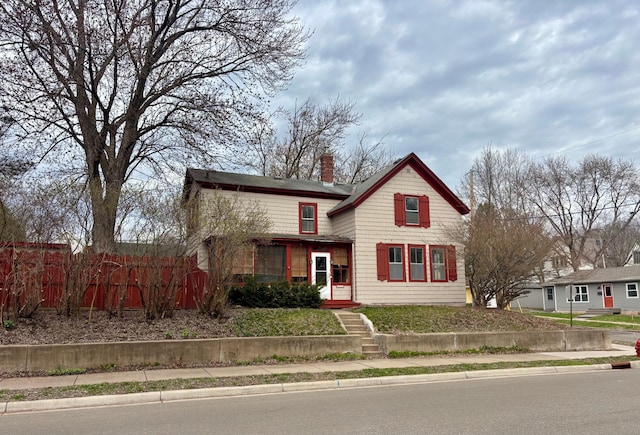 718 4th St N, Stillwater, MN 55082 - traditional-style home with a chimney and fence