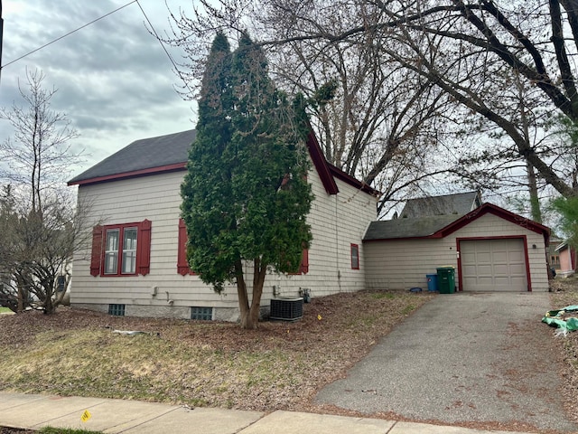 718 4th St N, Stillwater, MN 55082 - view of side of home with a chimney, aphalt driveway, cooling unit, a garage, and roof with shingles