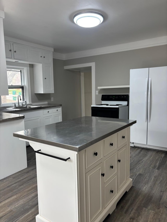 718 4th St N, Stillwater, MN 55082 - kitchen featuring dark countertops, electric stove, dark wood-style floors, and freestanding refrigerator
