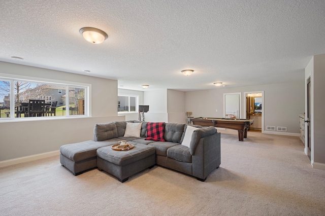 12816 Cedar Ridge Ln, Champlin, MN 55316 - living area with pool table, light colored carpet, and a textured ceiling
