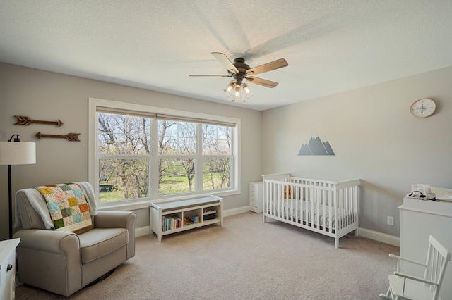 12816 Cedar Ridge Ln, Champlin, MN 55316 - bedroom with carpet flooring, a crib, a ceiling fan, and a textured ceiling