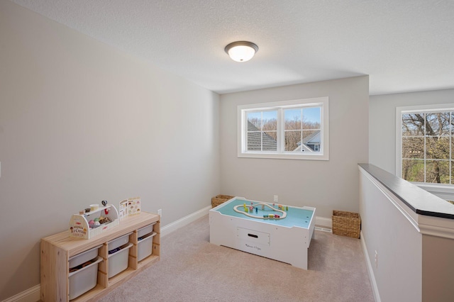 12816 Cedar Ridge Ln, Champlin, MN 55316 - game room featuring carpet floors and a textured ceiling