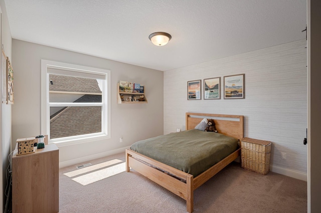 12816 Cedar Ridge Ln, Champlin, MN 55316 - carpeted bedroom featuring baseboards and wooden walls