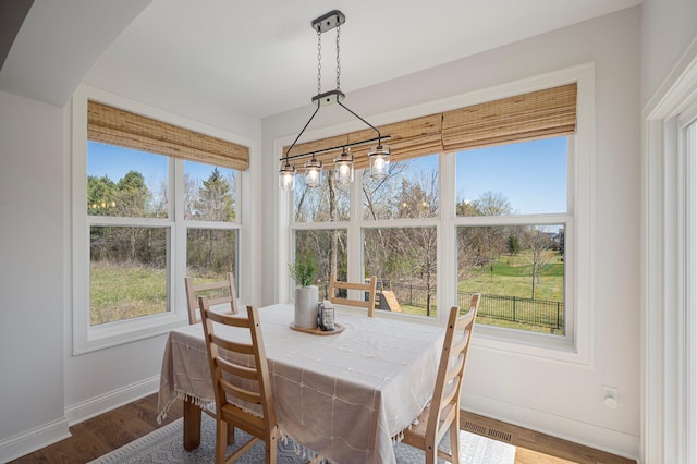 12816 Cedar Ridge Ln, Champlin, MN 55316 - dining area with baseboards and wood finished floors