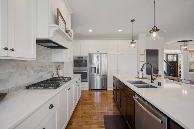 12816 Cedar Ridge Ln, Champlin, MN 55316 - kitchen featuring stainless steel appliances, white cabinetry, backsplash, hanging light fixtures, and recessed lighting
