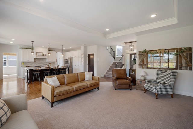 12816 Cedar Ridge Ln, Champlin, MN 55316 - living room with plenty of natural light, stairway, ornamental molding, recessed lighting, and a raised ceiling