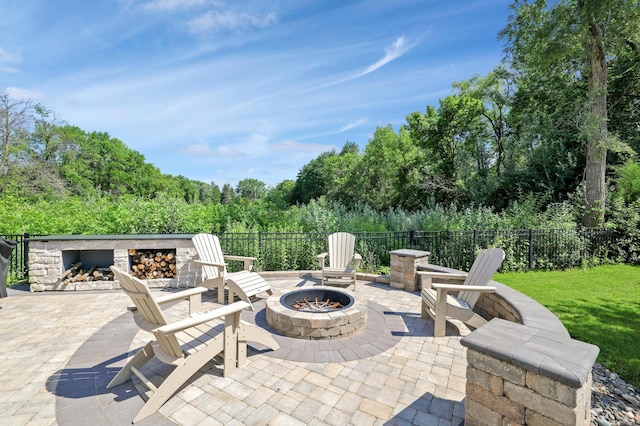 12816 Cedar Ridge Ln, Champlin, MN 55316 - view of patio with an outdoor fire pit and an outdoor stone fireplace