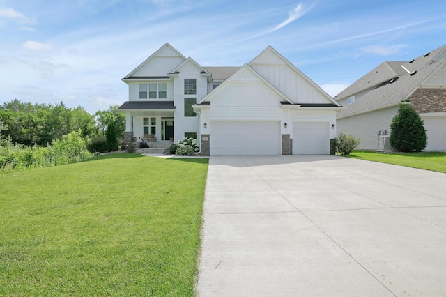 12816 Cedar Ridge Ln, Champlin, MN 55316 - craftsman-style house with board and batten siding, an attached garage, stone siding, a front lawn, and concrete driveway