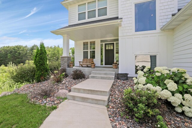 12816 Cedar Ridge Ln, Champlin, MN 55316 - entrance to property featuring covered porch and board and batten siding