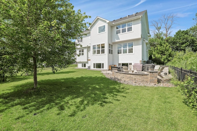 12816 Cedar Ridge Ln, Champlin, MN 55316 - back of property featuring a patio area and a fire pit