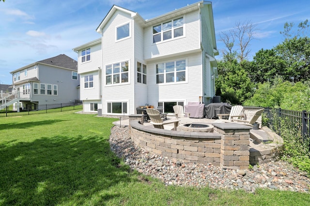 12816 Cedar Ridge Ln, Champlin, MN 55316 - back of property with an outdoor fire pit and a patio area