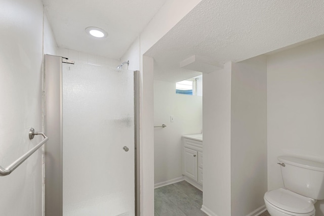 full bathroom featuring vanity, toilet, and a shower stall