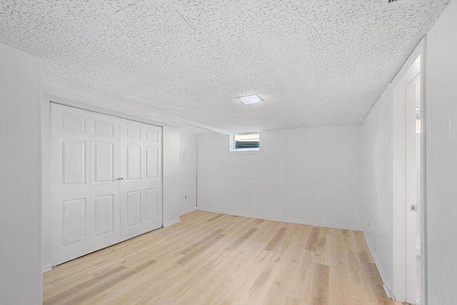 interior space featuring baseboards and light wood-style flooring