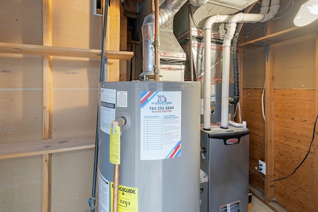 utility room featuring water heater