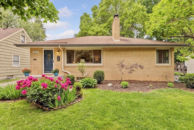4024 Quentin Ave, Saint Louis Park, MN 55416 - view of front of home with a front yard, a chimney, brick siding, and roof with shingles