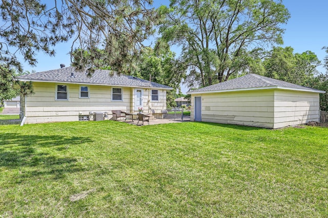 11352 Olive St NW, Coon Rapids, MN 55448 - back of property with a patio and roof with shingles