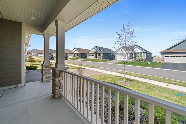 balcony with covered porch and a residential view