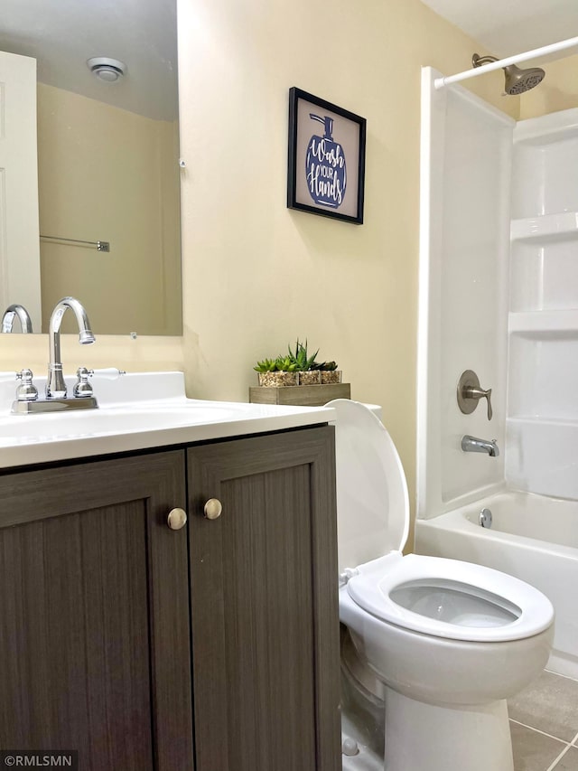 full bathroom featuring shower / bathing tub combination, tile patterned floors, vanity, and toilet