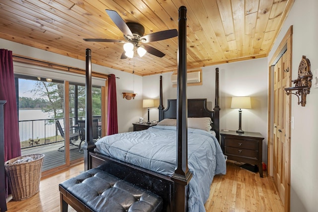 bedroom featuring light wood-style flooring, wooden ceiling, an AC wall unit, a water view, and access to outside